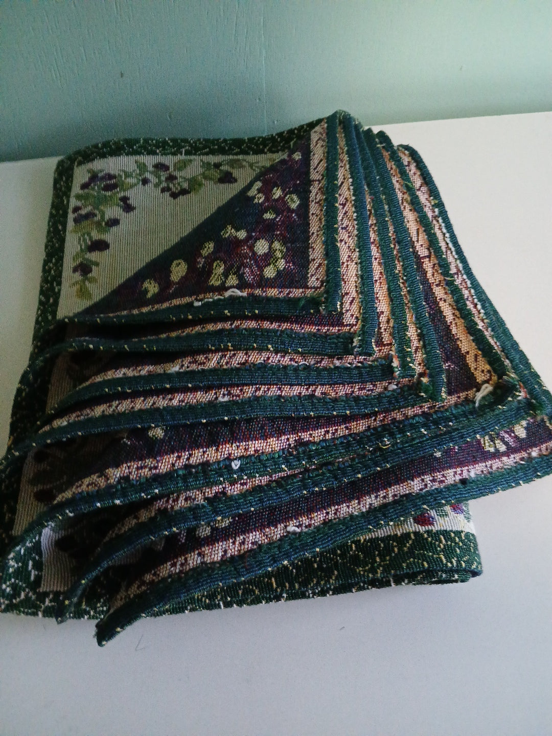 8 piece country placemat set . Fruit and flowers tapestry